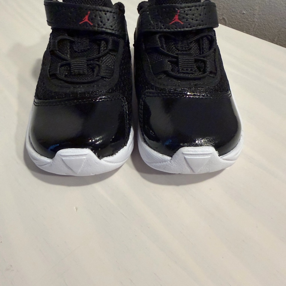 Jordan Kids Black and White Sneakers with Red Accents